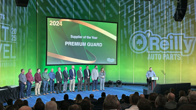 pgi team on stage to accept to awards from o'reilly auto parts at leadership conference