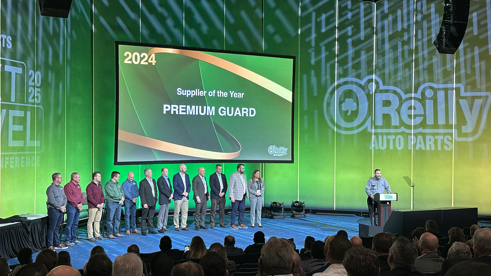 pgi team on stage to accept to awards from o'reilly auto parts at leadership conference